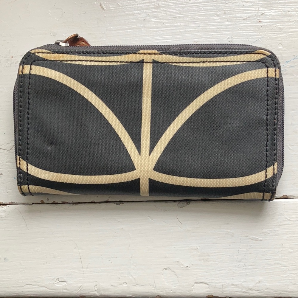 Orla Kiely wallet, black with beige pattern. Orange interior.